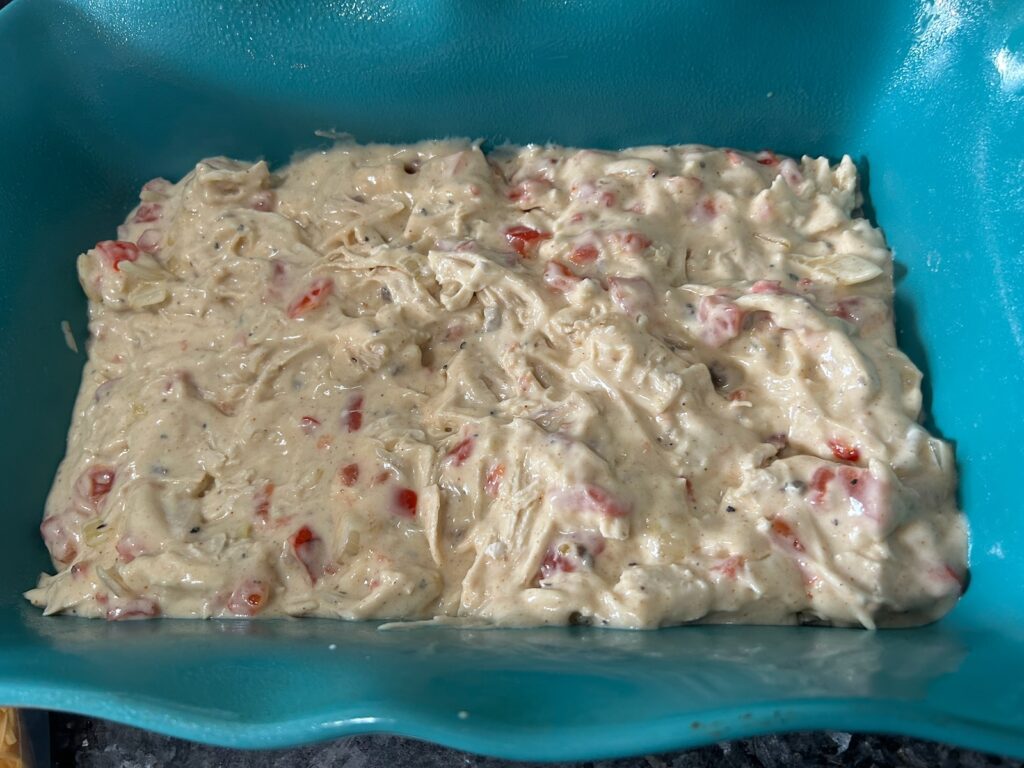 Easy King Ranch Chicken (Texas Style) layering in casserole dish