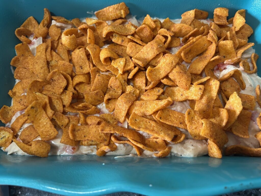 Easy King Ranch Chicken (Texas Style) layering in casserole dish