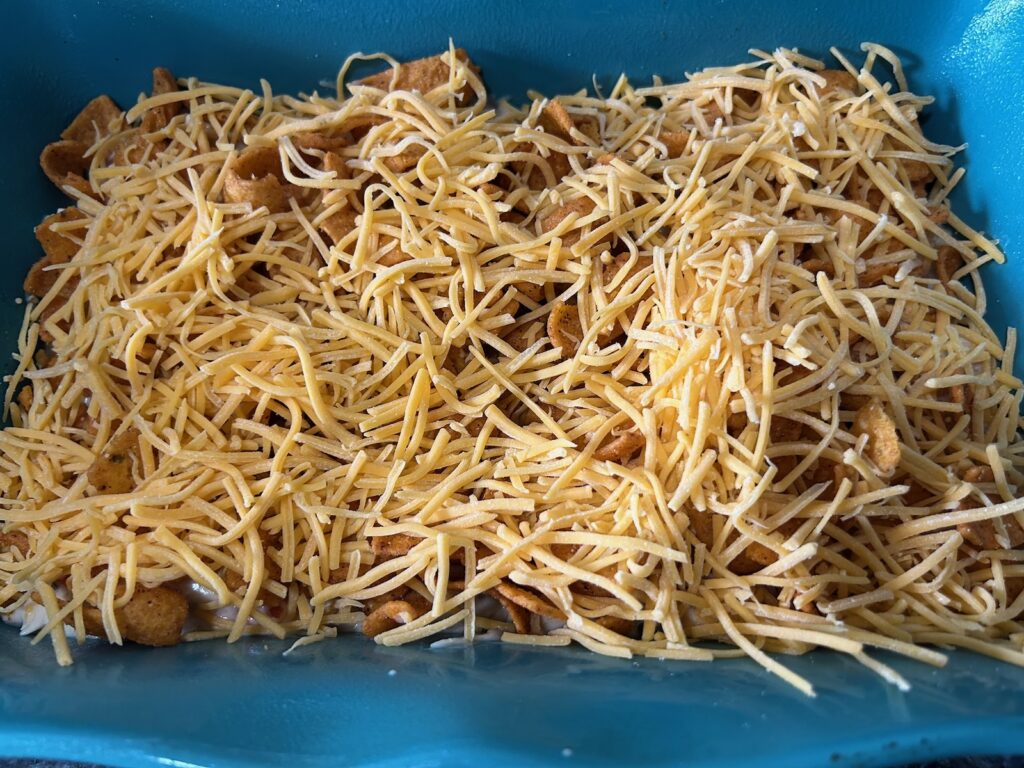Easy King Ranch Chicken (Texas Style) layering in casserole dish