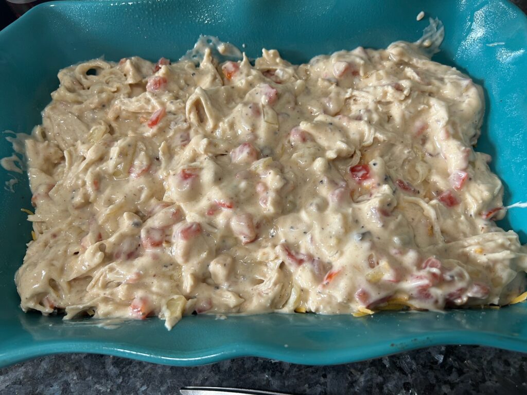 Easy King Ranch Chicken (Texas Style) layering in casserole dish