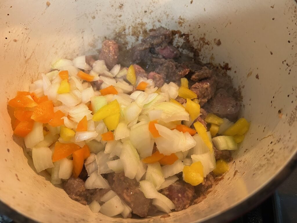 Dutch Oven Beef Stew (Texas Style) simmering on stove