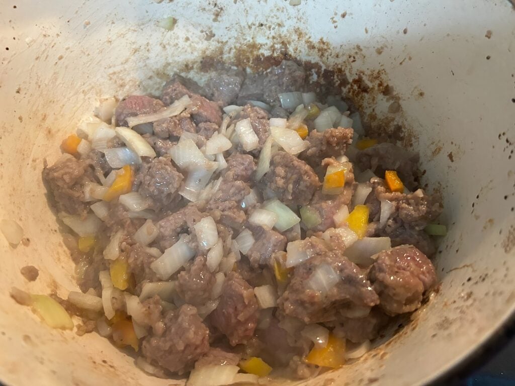 Dutch Oven Beef Stew (Texas Style) simmering on stove