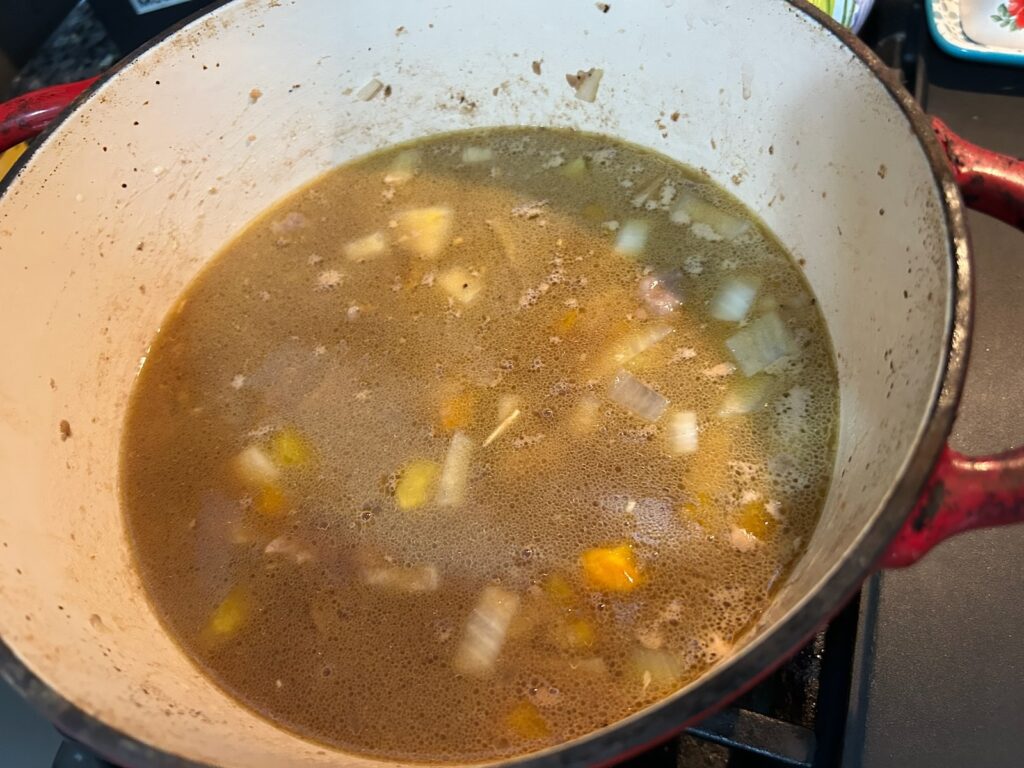 Dutch Oven Beef Stew (Texas Style) simmering on stove