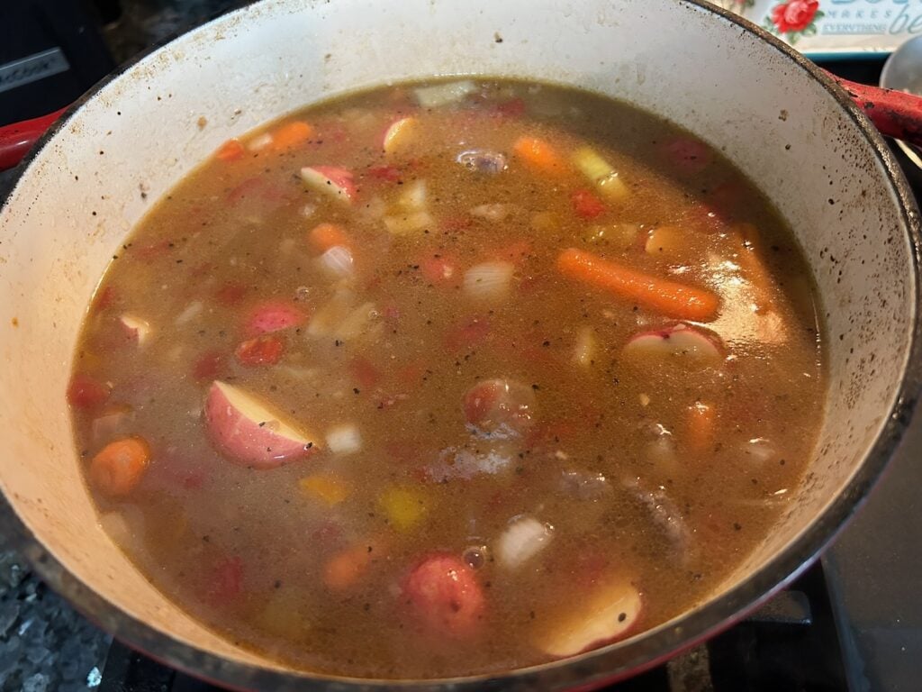 Dutch Oven Beef Stew (Texas Style) simmering on stove
