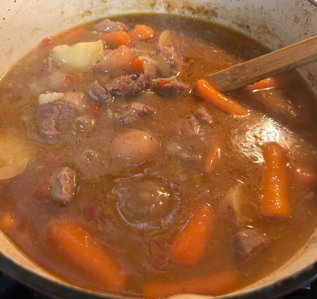 Dutch Oven Beef Stew (Texas Style) simmering on stove
