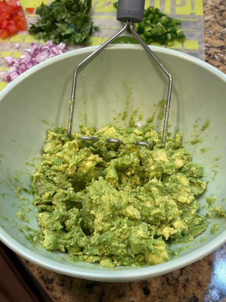 mashing avocado