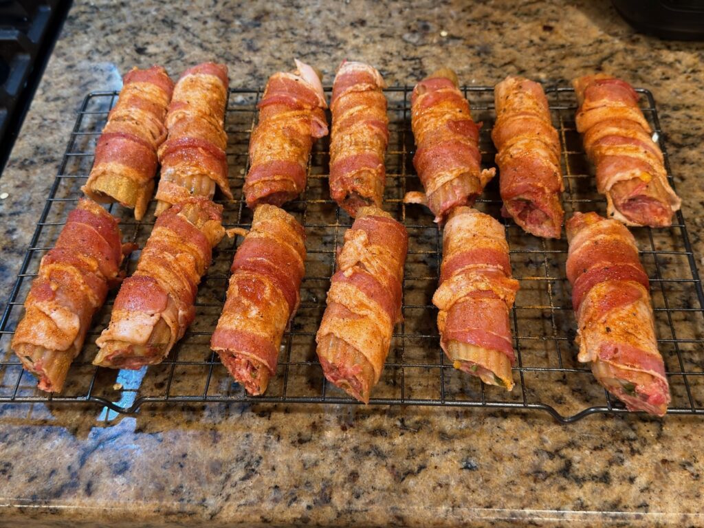 Smoked Shotgun Shells (Bacon-Wrapped Manicotti) adding seasoning