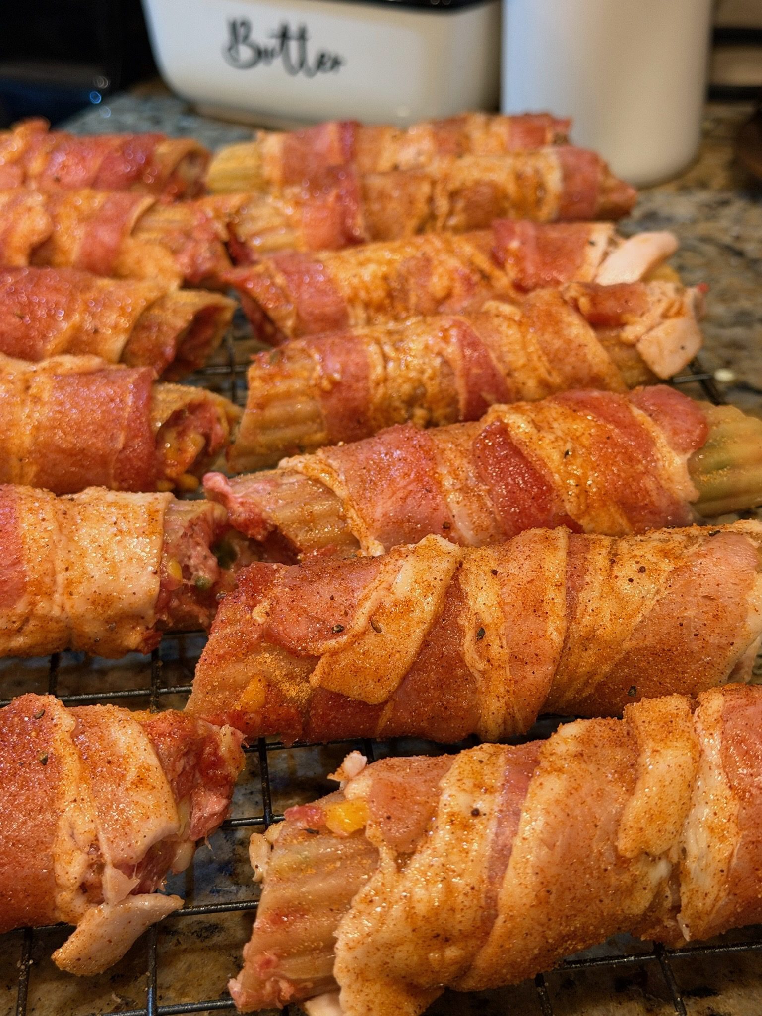 Smoked Shotgun Shells (Bacon-Wrapped Manicotti) seasoned and ready to go in the refrigerator to rest