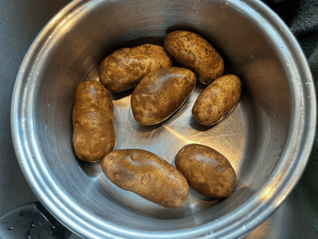 washed potatoes in pan