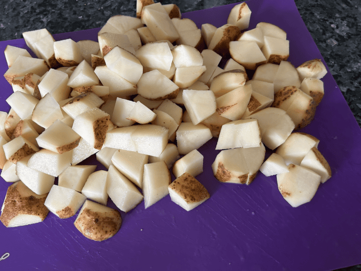 cubed potatoes on cutting mat