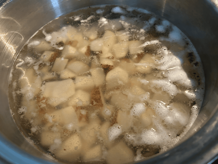 cubed potatoed boiling in water