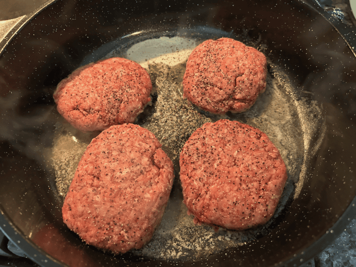 hamburger patties in skillet