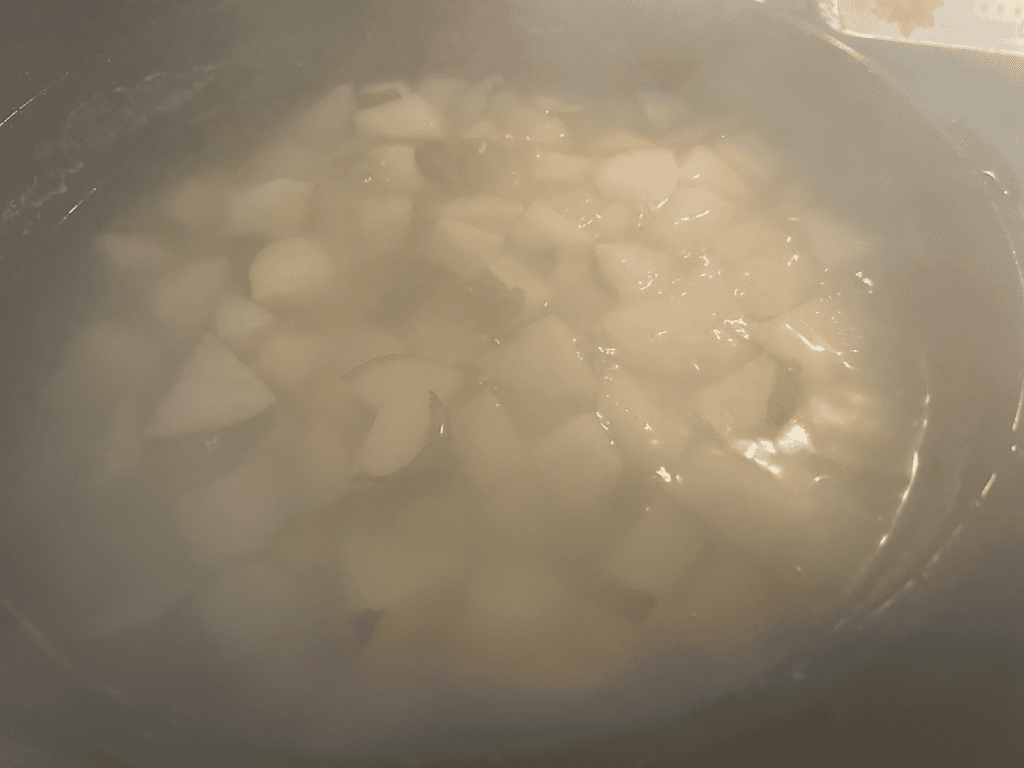 cubed russets in water on stove