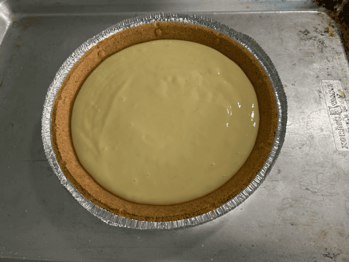 Easy Lemon Icebox Pie filling in graham cracker crust