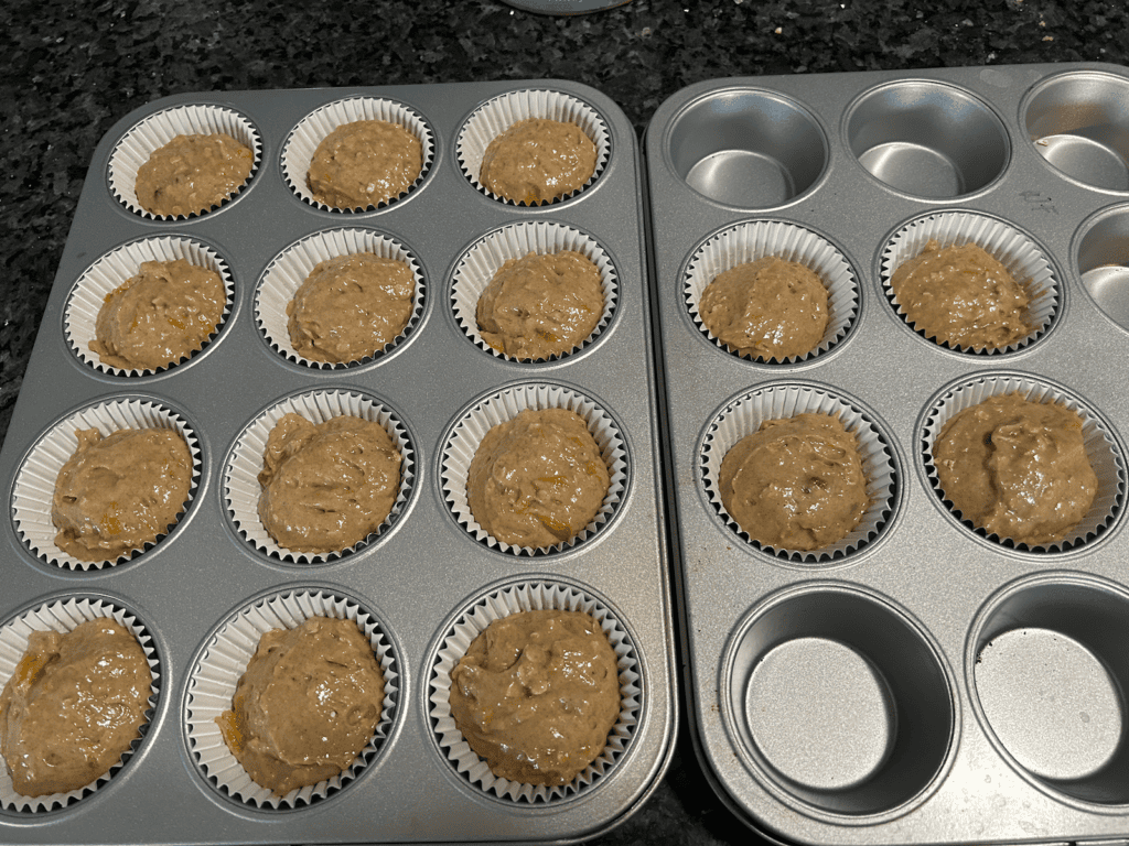 Easy Peach Streusel Muffin batter in cupcake liners