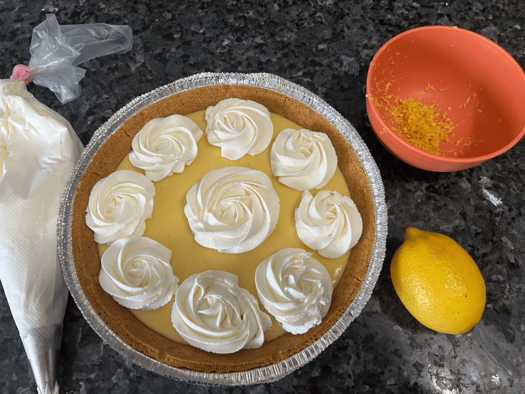 whipping cream rosettes on lemon pie
