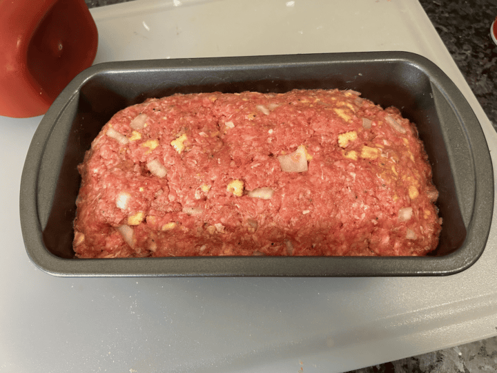 raw meatloaf in pan
