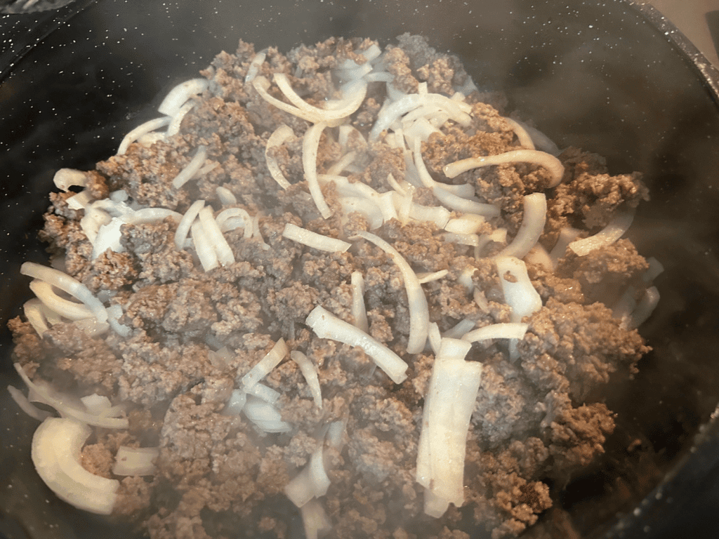 ground beef and onions in skillet