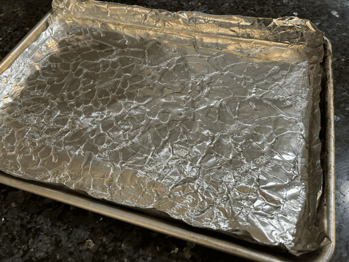 cookie sheet covered in foil lightly greased