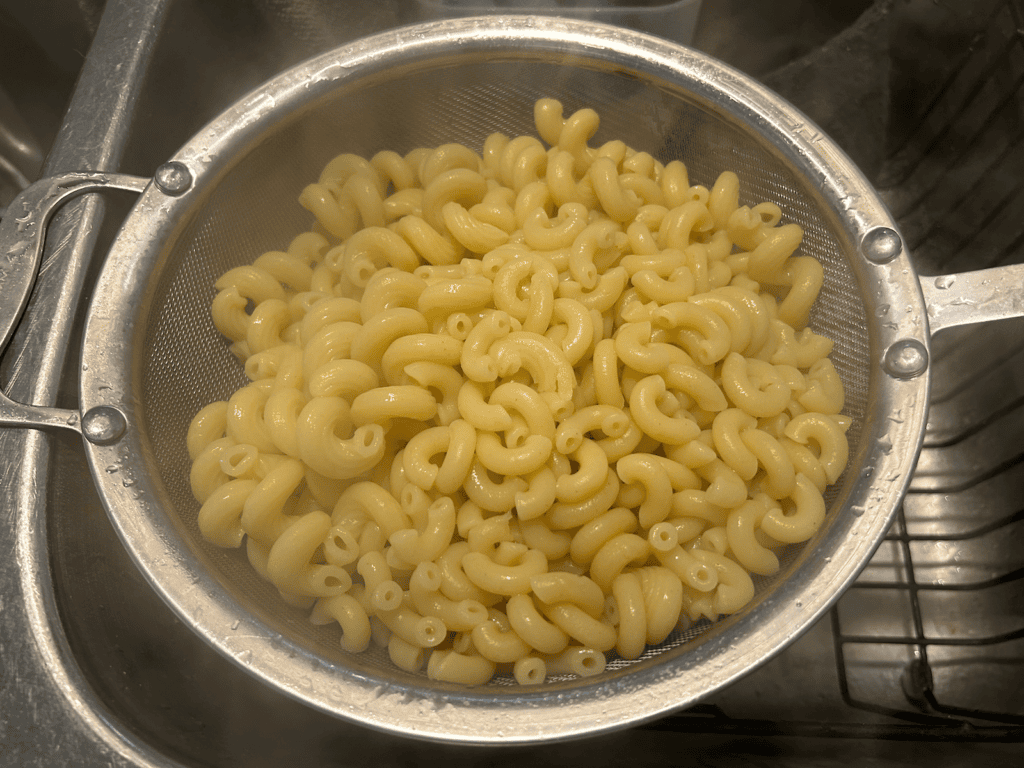 cooked pasta straining