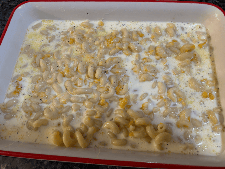 mac and cheese with creamy custard poured over it