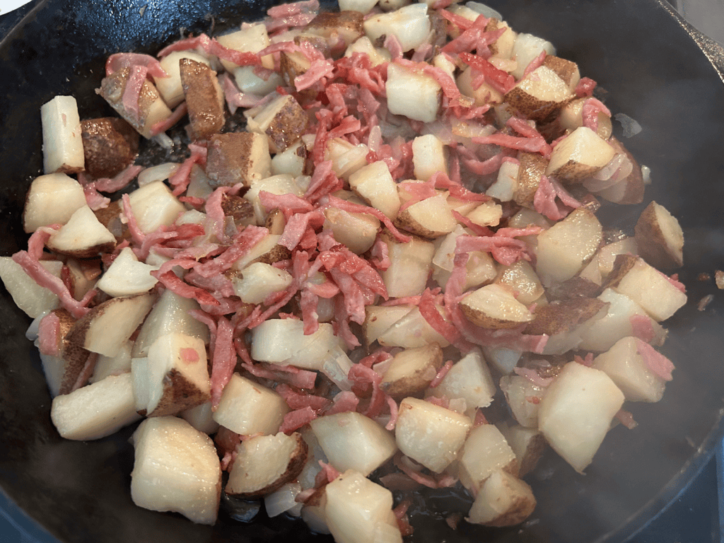 potatoes and ham in skillet
