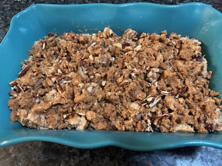 Cinnamon Roll French Toast Casserole in dish with streusel topping