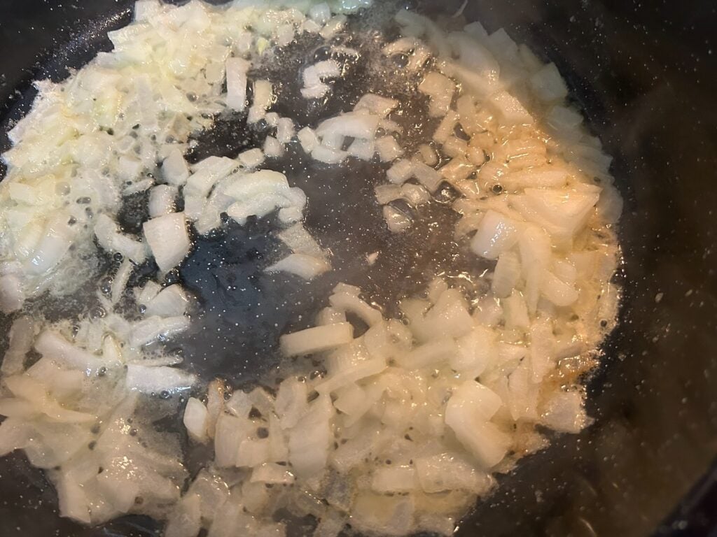 onion simmering in pan