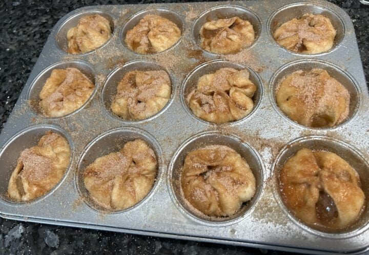 Easy Caramel Apple Dumplings with Cinnamon Sugar on messy tray
