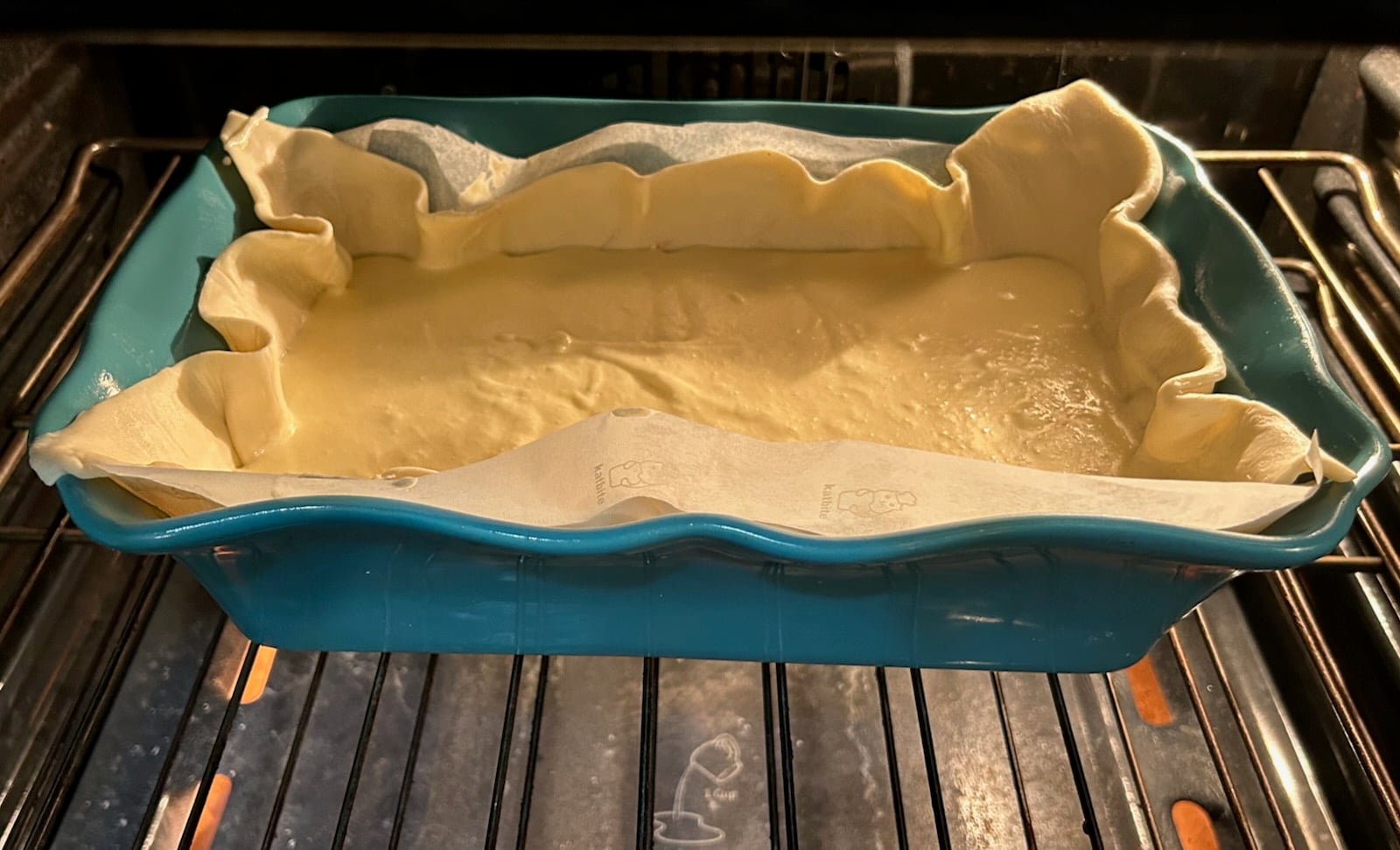 Southern Gooey Butter Bars with Cherries in oven