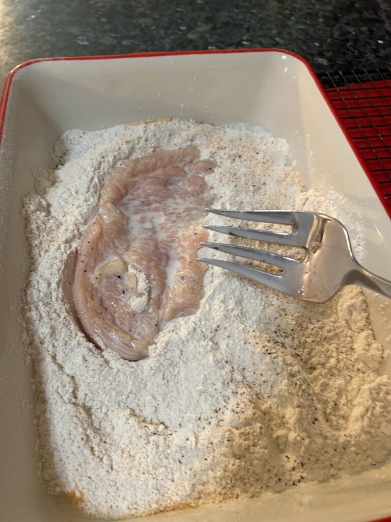dredging chicken in flour