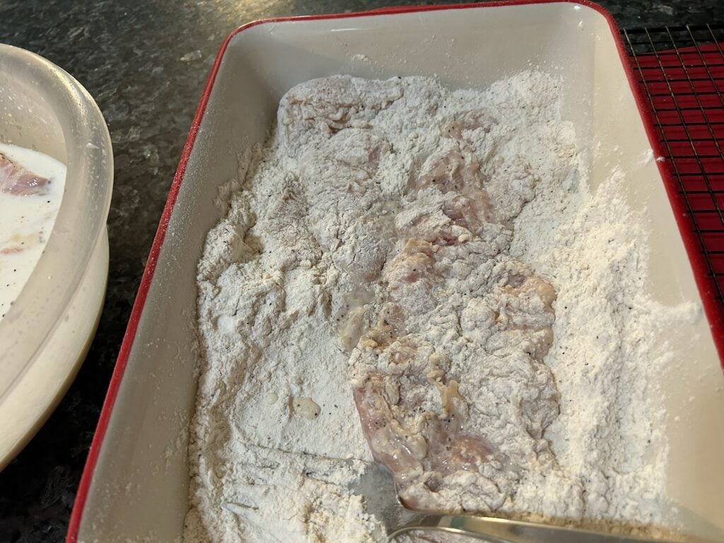 dredging chicken in flour