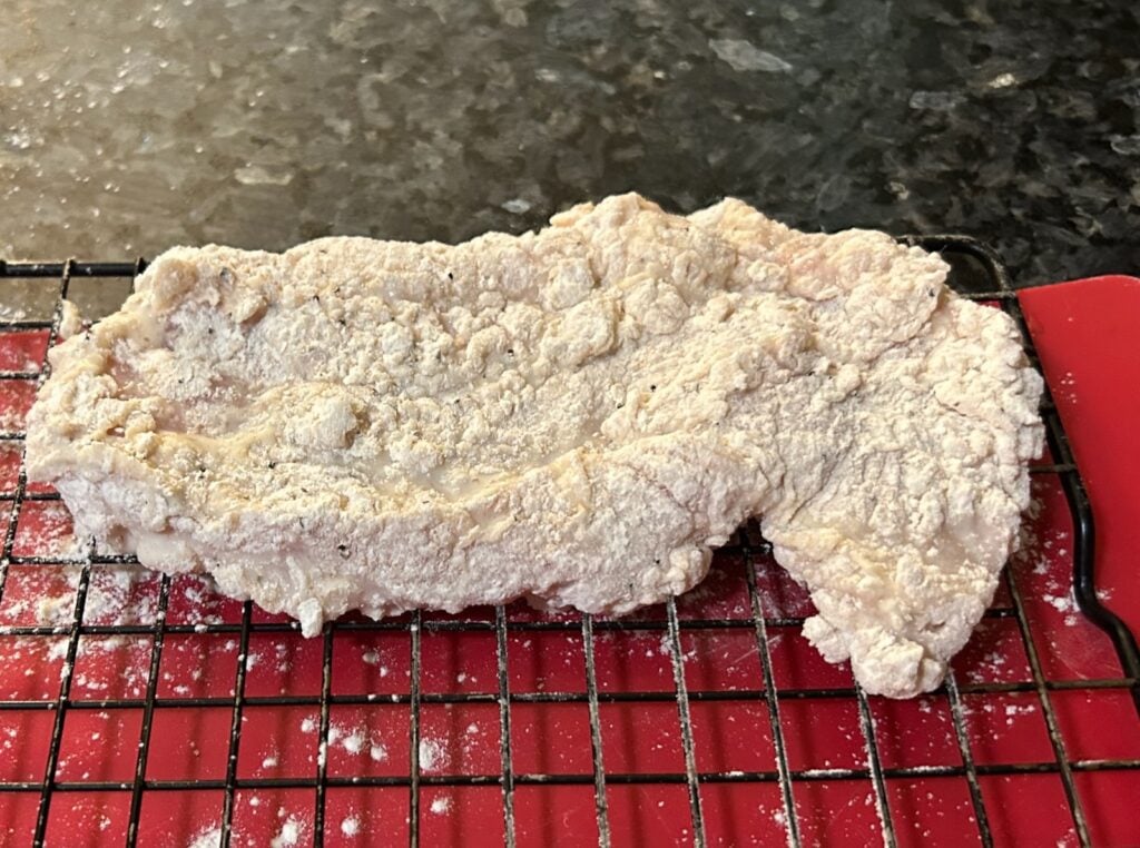 dredging chicken in flour
