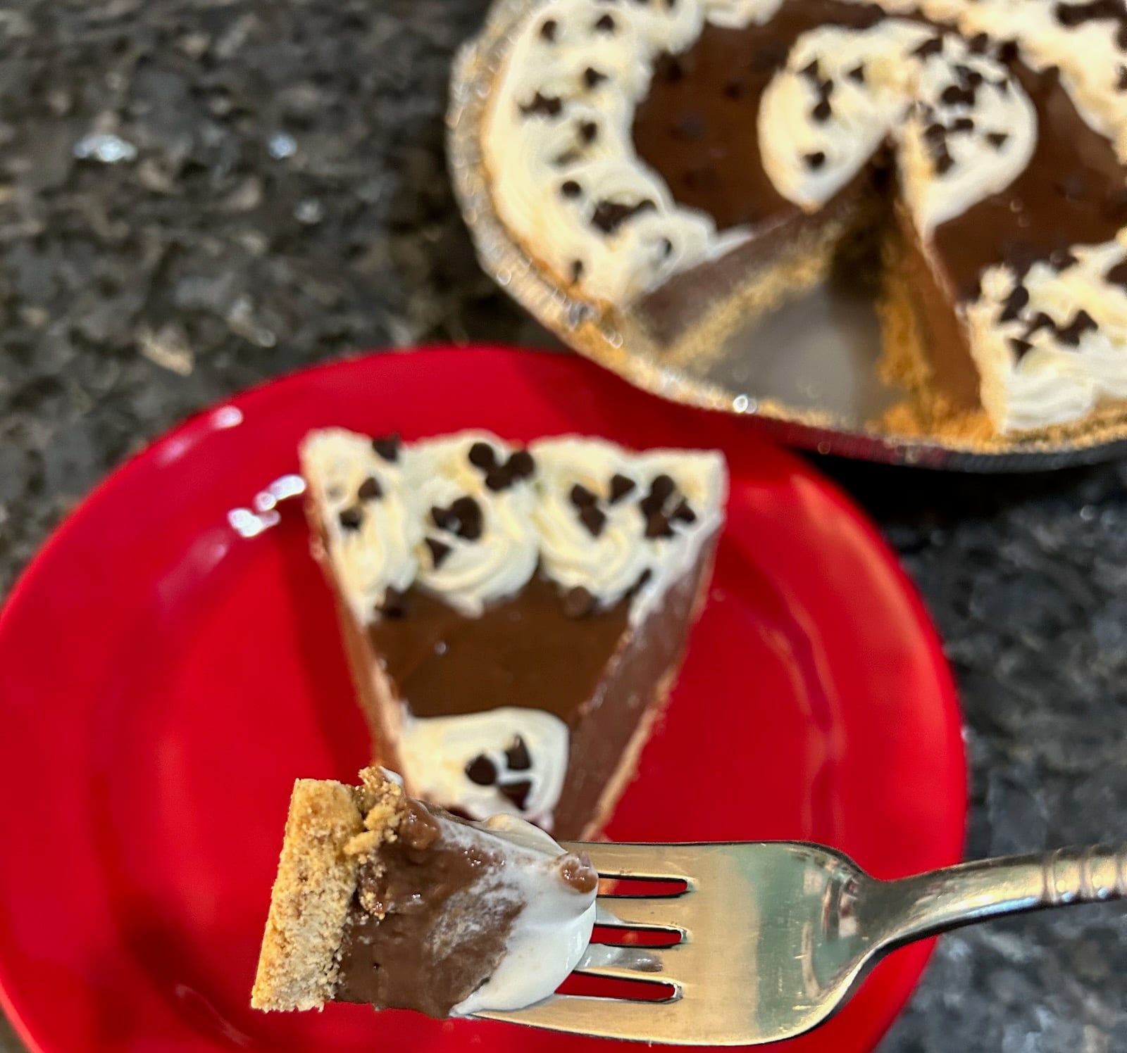 taking a bite of the chocolate pie